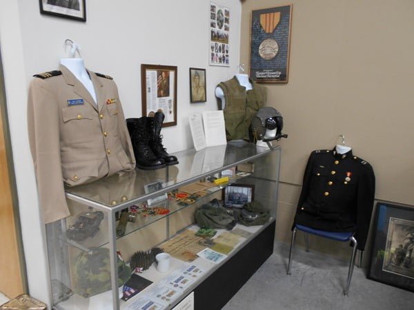 Badges and uniform display at Camp Gordan Johnston Museum