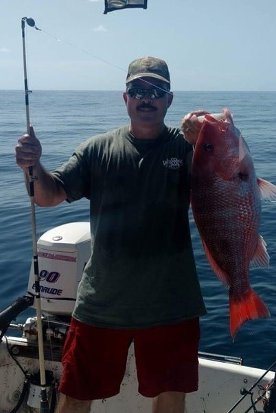 Man holding Snapper Gritwater Outfitters USA