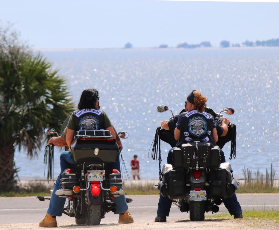 Two motorcycles sit with the St. George Sound in the background