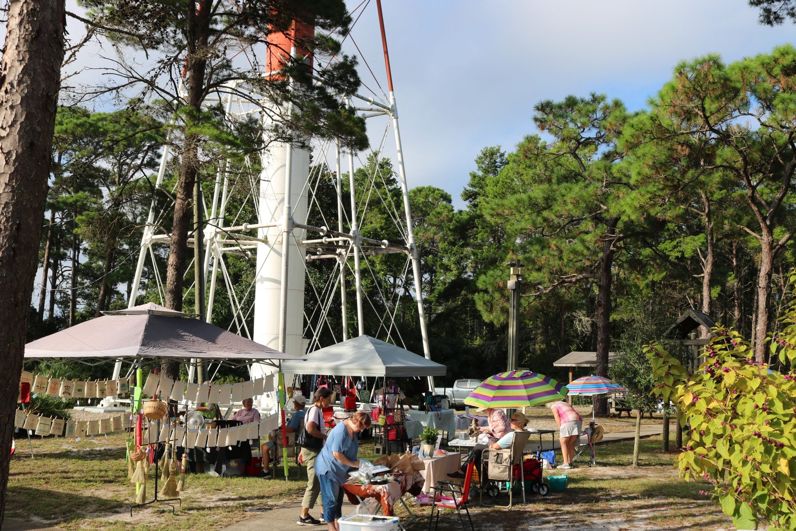 Vendor market booths at the foot of Crooked River Lighthouse