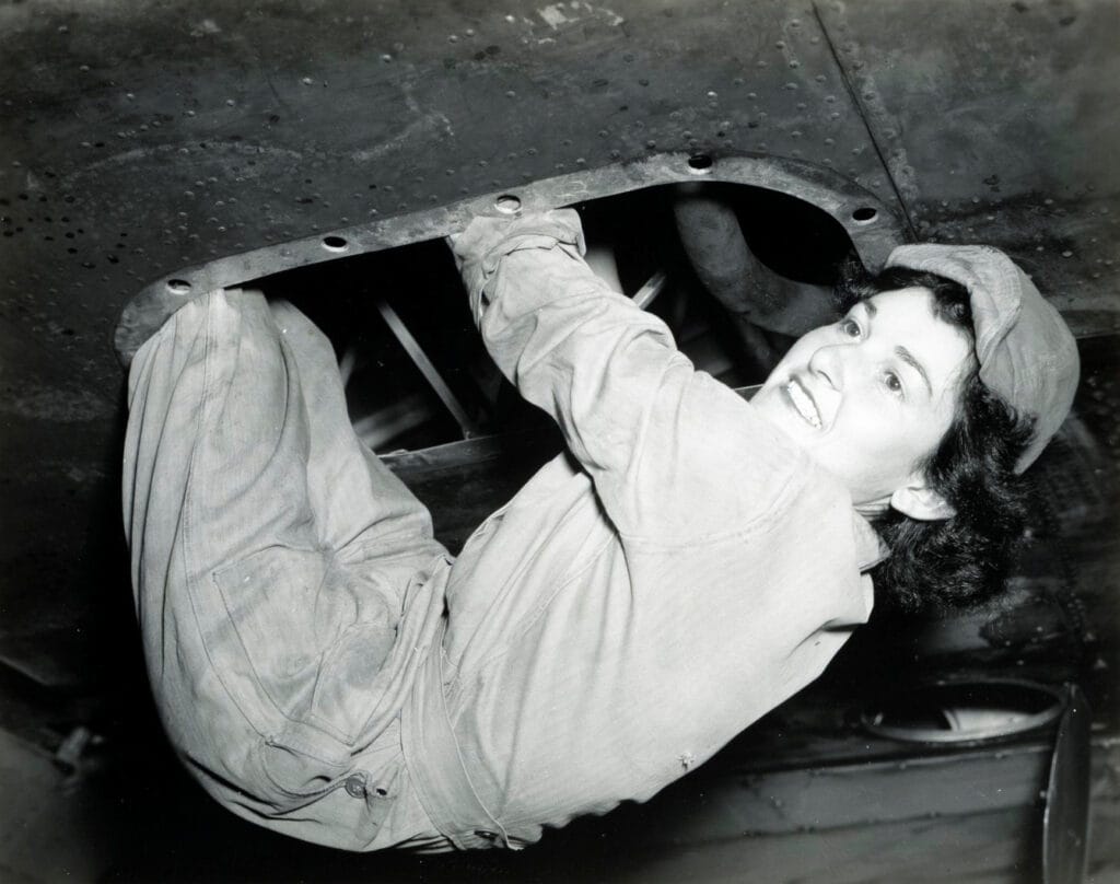 World War II WAC aircraft mechanic Private Dorothy Bumstead of Beaumont, Texas, hangs from underneath the wing of a B-17 bomber at Tyndall Field in Florida World War II WAC aircraft mechanic Private Dorothy Bumstead of Beaumont, Texas, hangs from underneath the wing of a B-17 bomber at Tyndall Field in Florida